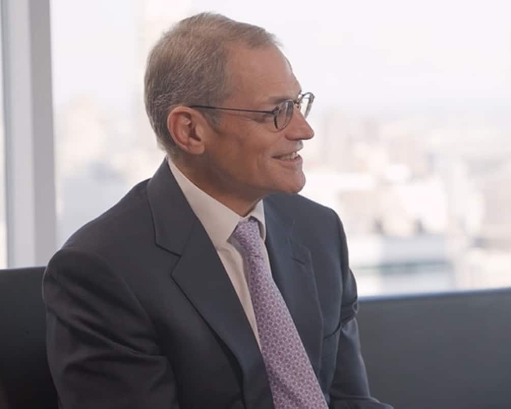 Michael Fisch seated in an American Securities office