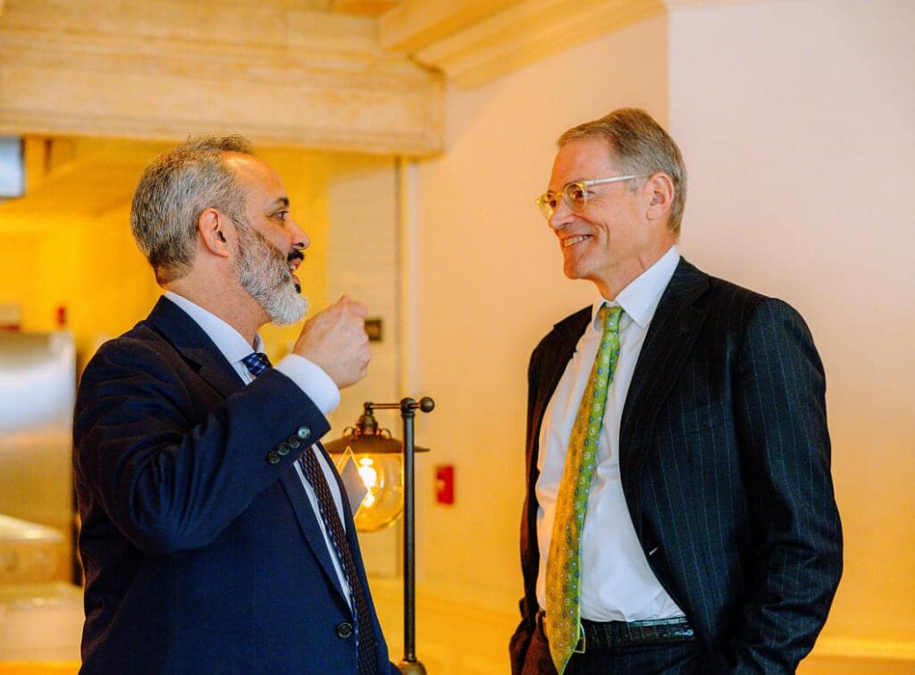 Michael Fisch in conversation at a leadership event focused on long-term impact