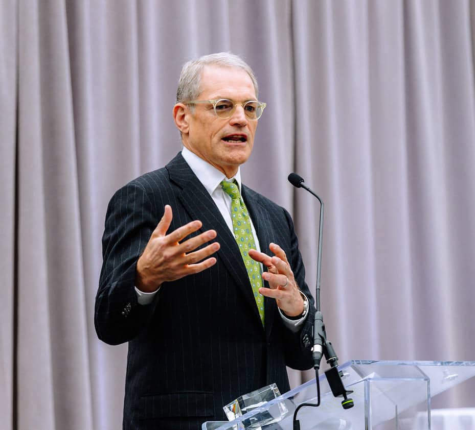 Michael Fisch speaking at a conference on leadership and governance