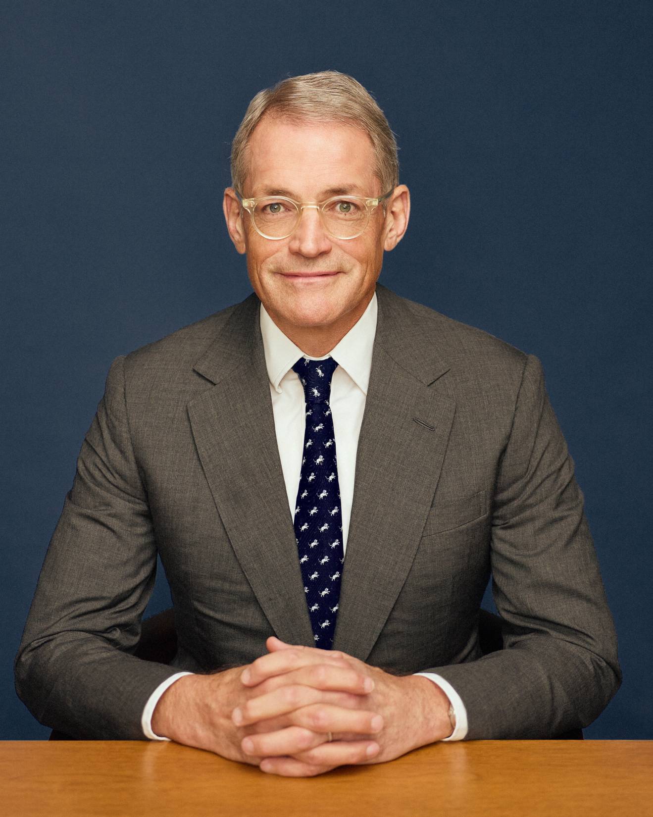 Michael Fisch, founder and CEO of American Securities, standing in a dark suit